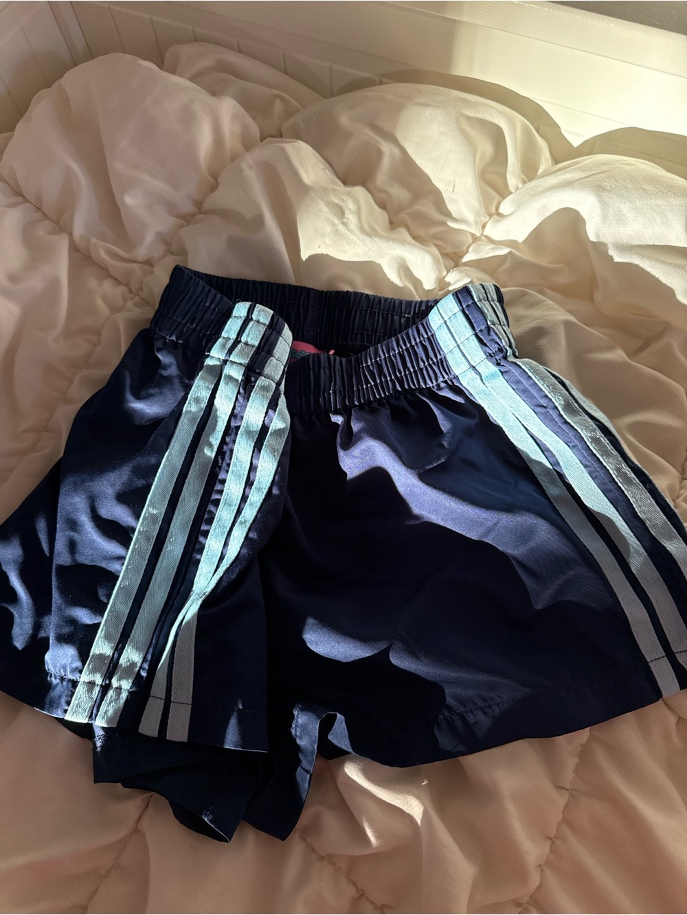 Edikted Navy Athletic Shorts with Light Blue Side Stripes